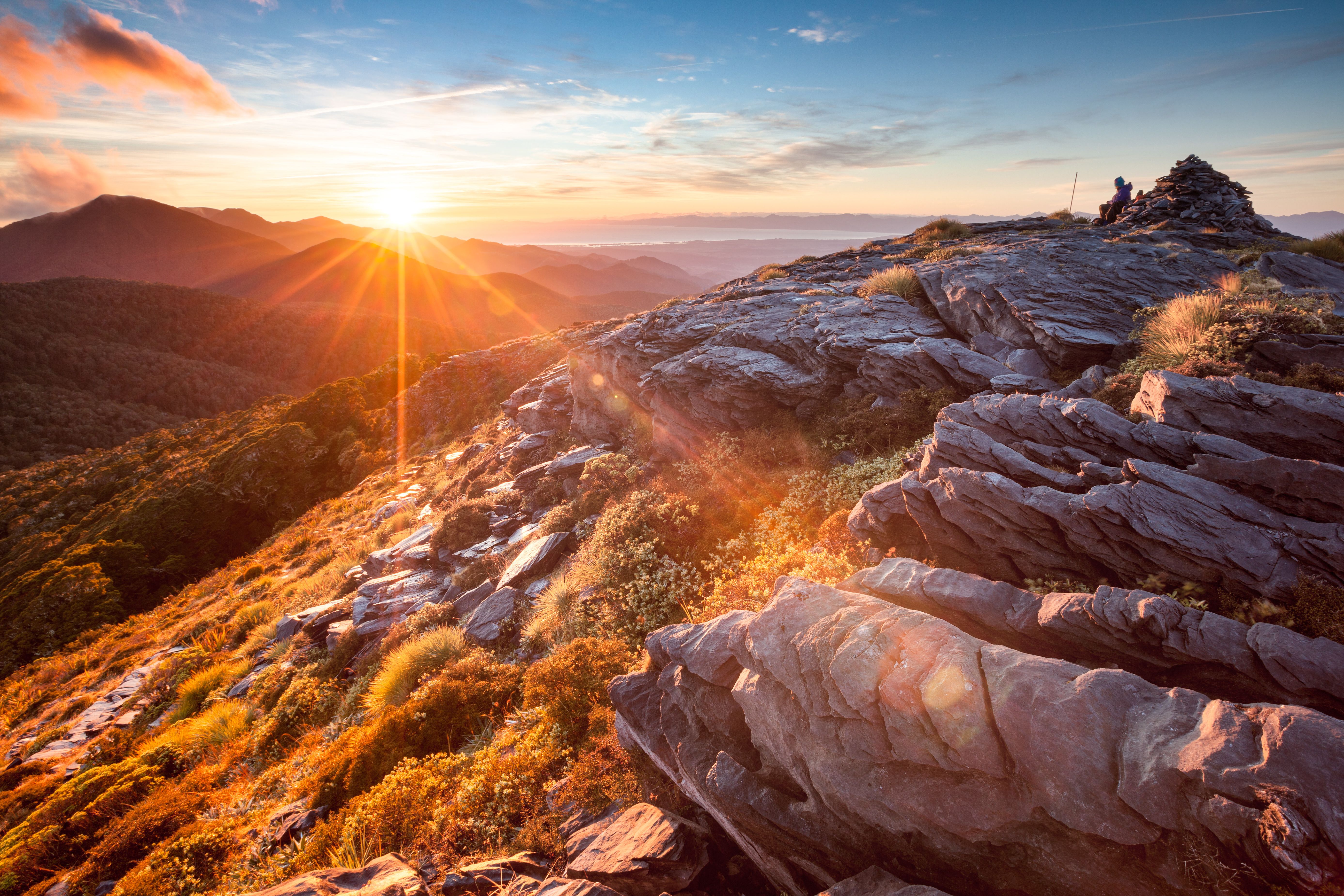 Sunrise breaking over broken rock on the tops