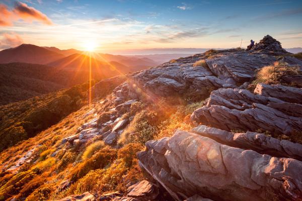 Sunrise breaking over broken rock on the tops