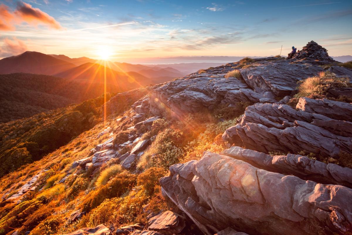 Sunrise breaking over broken rock on the tops