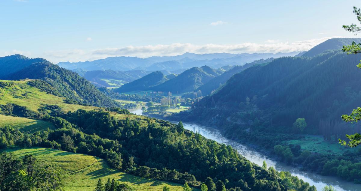 River winding through steep green hill country