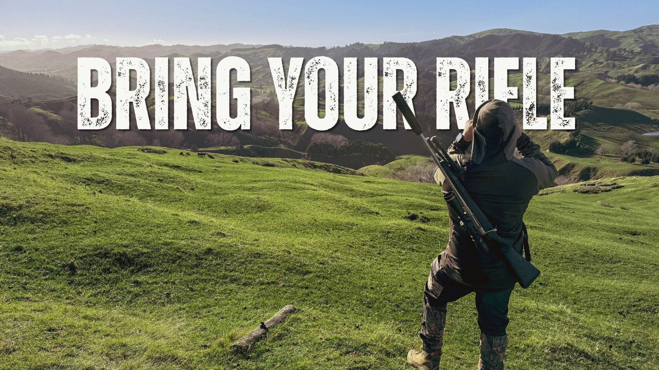 A hunter with a scoped, suppressed rifle slung over his shoulder glasses across rolling green hill country with binoculars, with the words "Bring Your Rifle" in bold distressed lettering across the top.