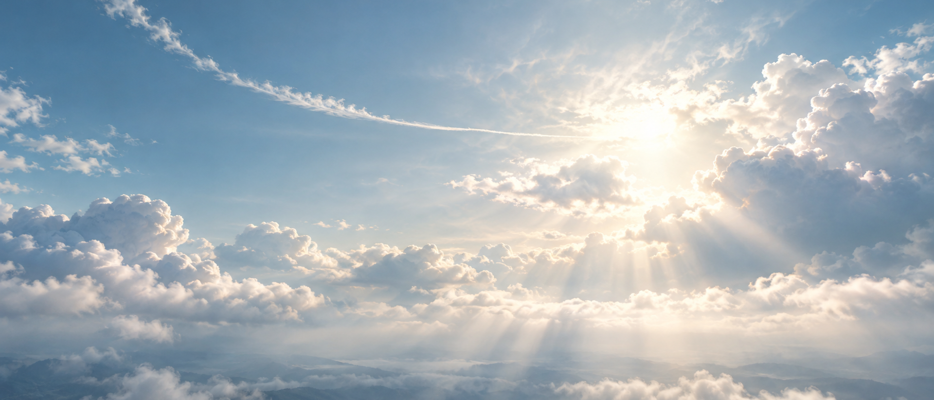 A bright overcast sky crossed by a single faint contrail.