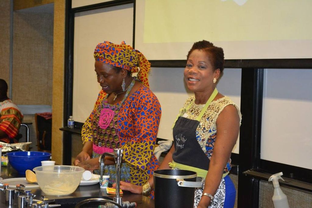 Two women lead a cooking class at the lab bench
