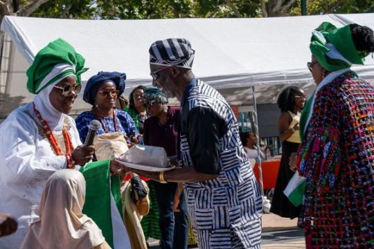 A gift is presented to the association's leaders at the opening