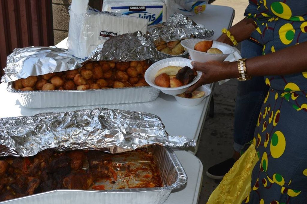Trays of puff-puff and stewed meat at the lunch table