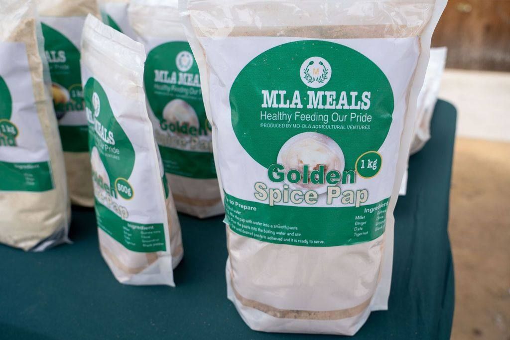 Bags of golden spice pap on a vendor table