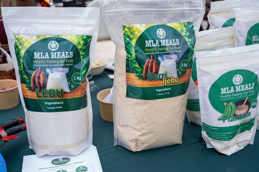 Bags of garri, lebu and plantain flour on a vendor table