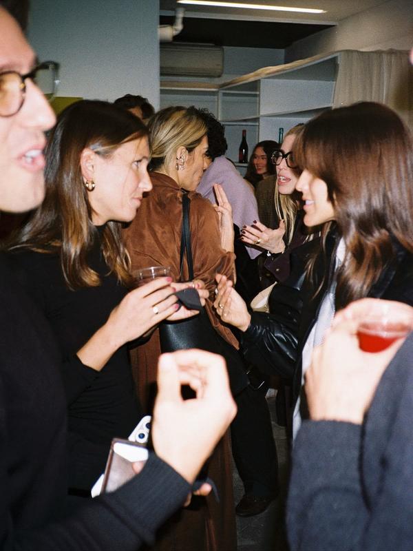 Members in conversation at an intimate gathering