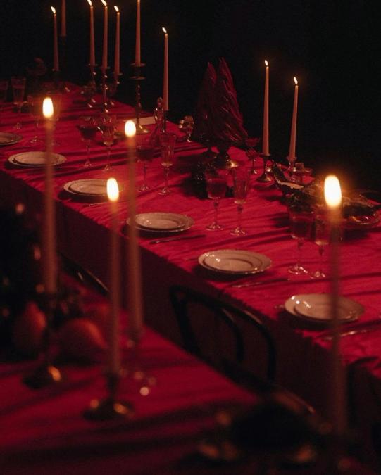 A candlelit table prepared for an Alter Circle gathering