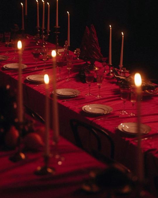 A candlelit table prepared for an Alter Circle gathering