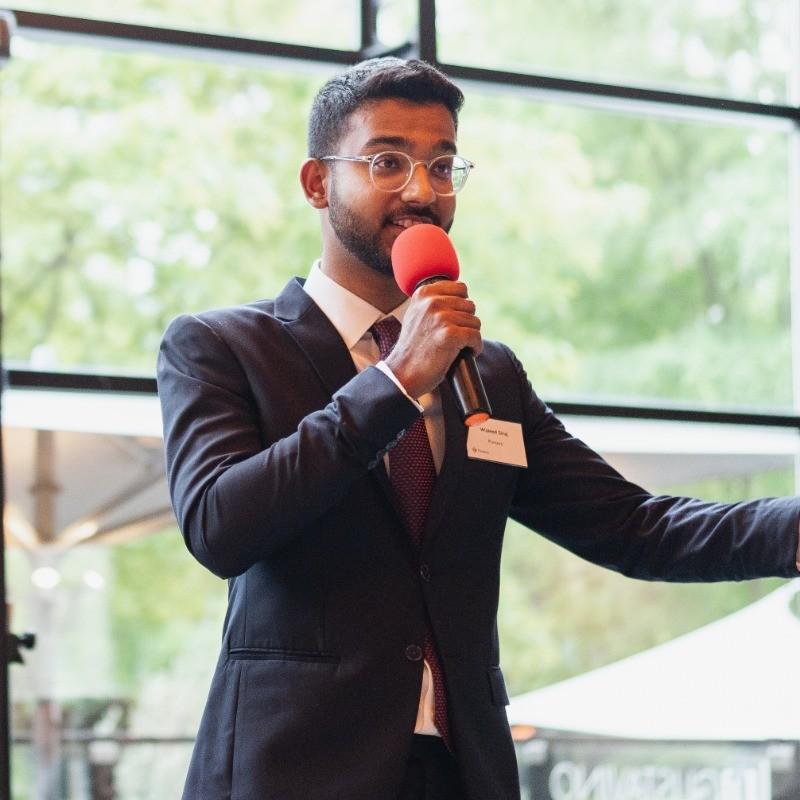 A man with a microphone expressing emotions
