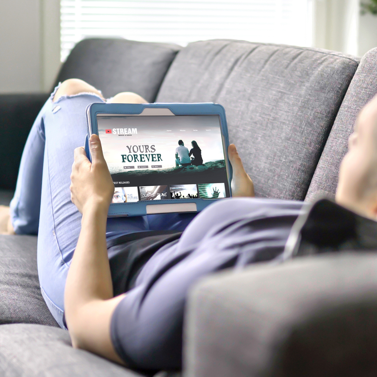 a person watching tv on a tablet