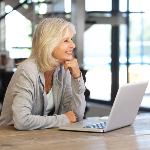 woman looking at her computer