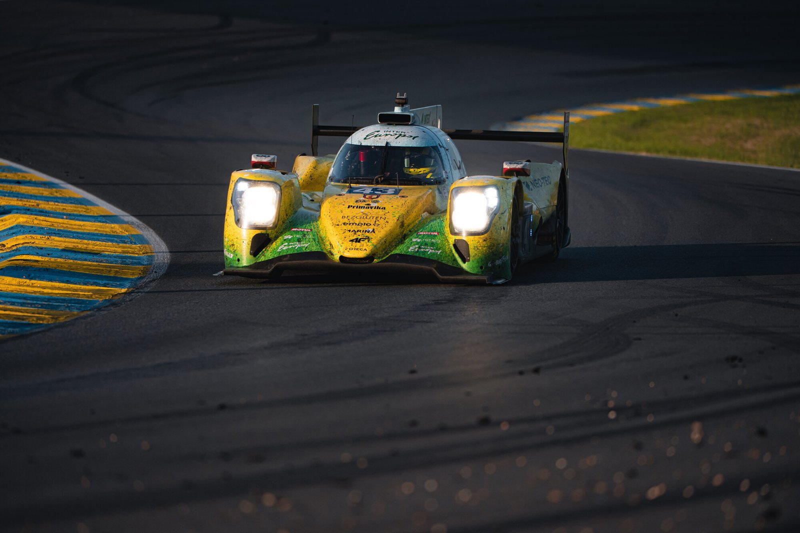 Inter Europol Competition Oreca LMP2 in the Lange & Lange rapeseed art-car livery head-on in golden evening light at Le Mans