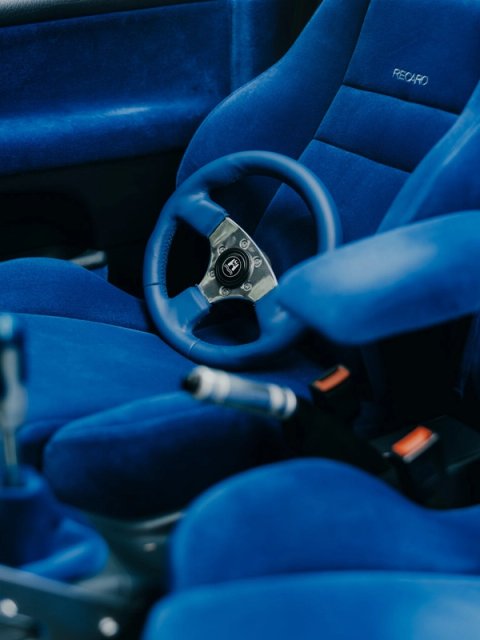 Blue velvet interior with Recaro seats and a blue leather steering wheel