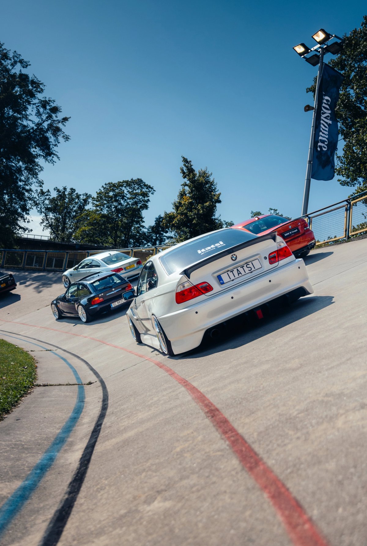 BMWs E46 on the velodrome banking shot from low angle on the concrete track