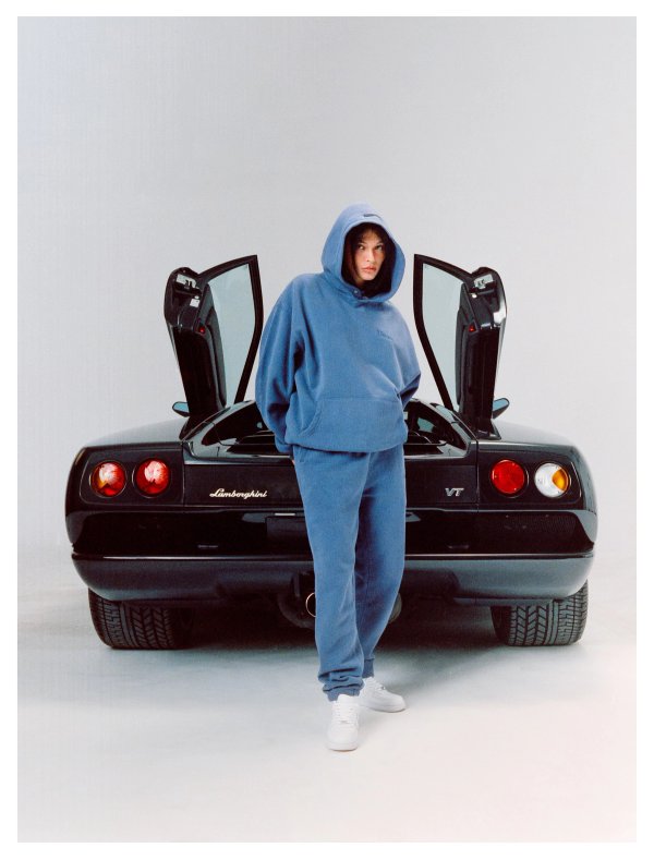 Model in blue hoodie standing in front of the Diablo VT with doors up