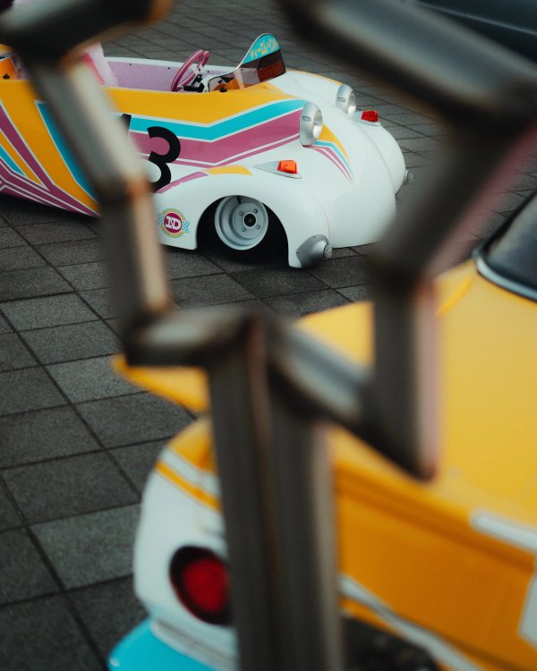 Colorful pastel Japanese race karts with retro pinstripe liveries