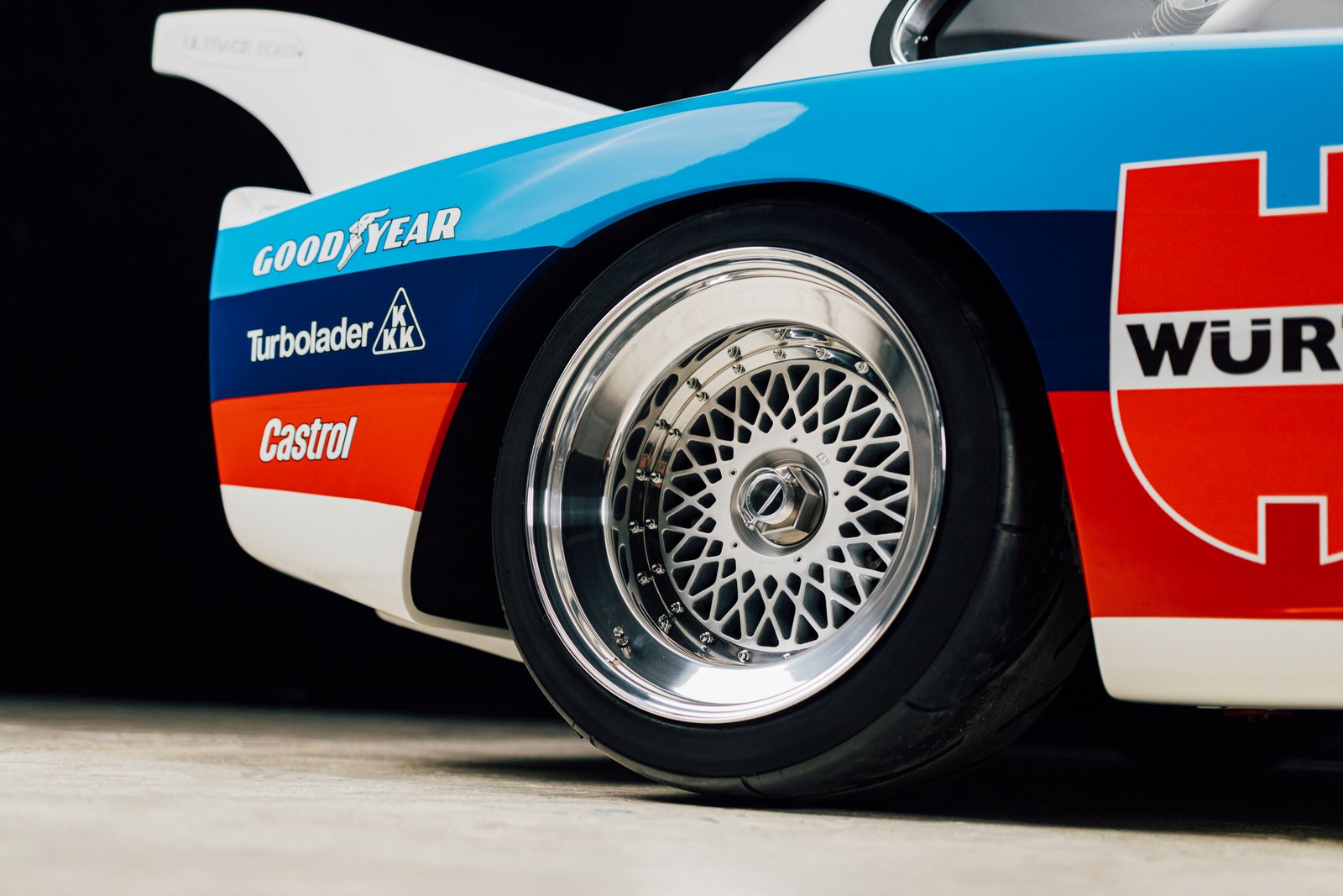 Close-up of BBS mesh wheel with Goodyear slick on BMW E21 Group 5 front fender