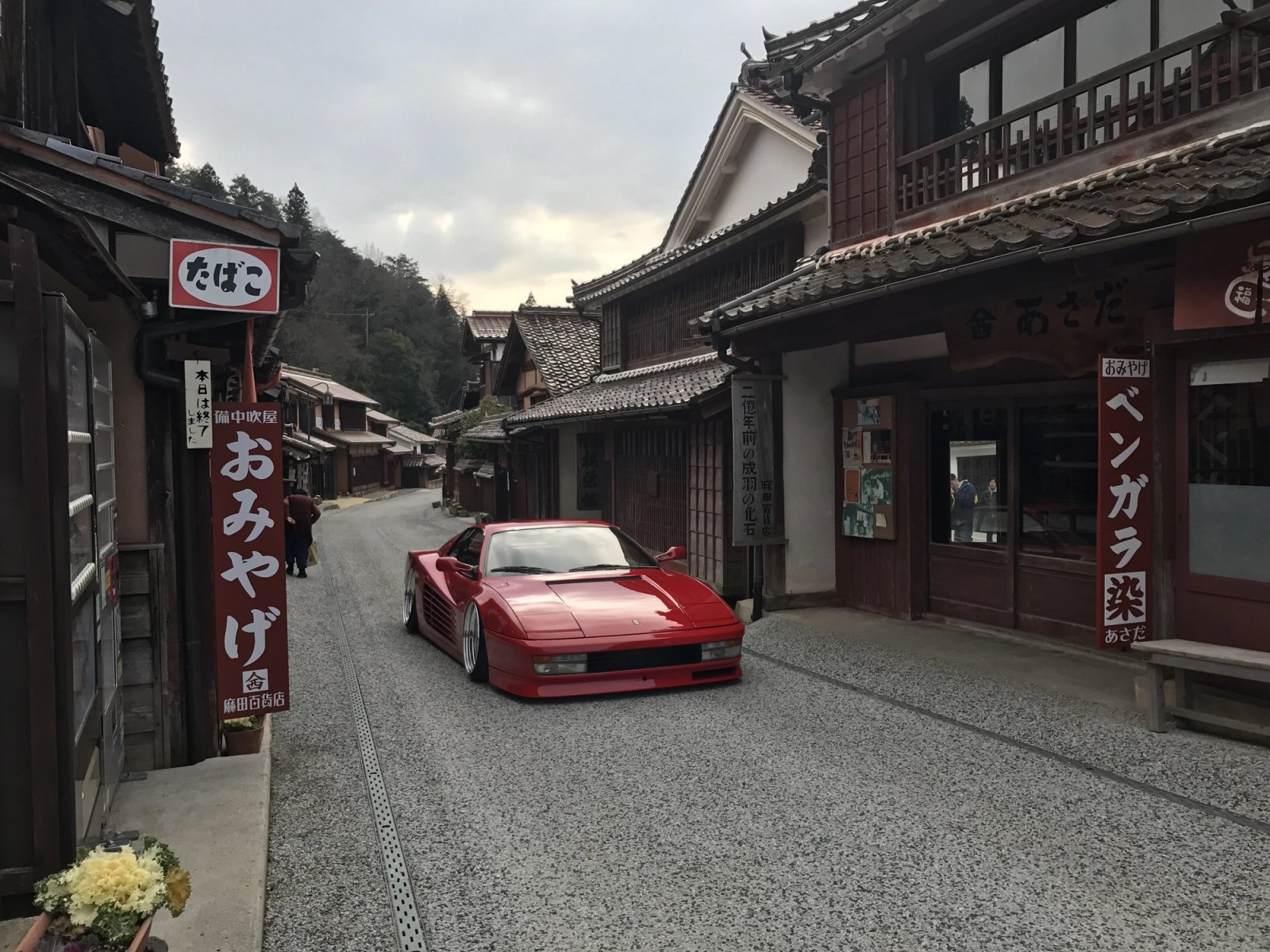 Red Ferrari Testarossa on a rural Japanese street