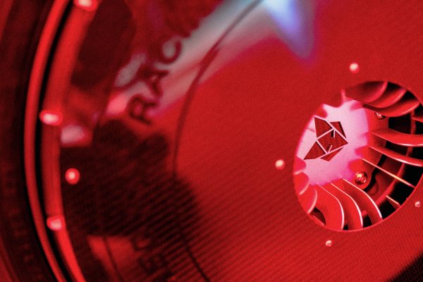 Close-up of Red Fox logo on the Taurus carbon bodywork under red light