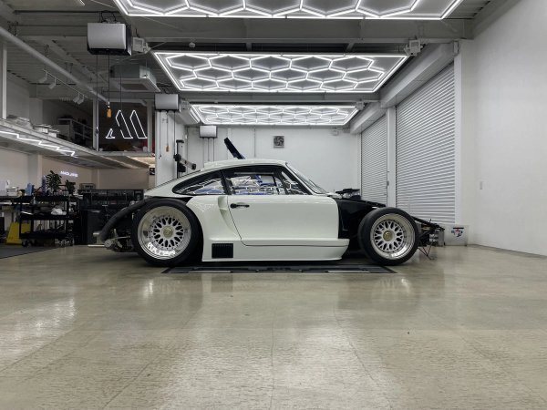 935ML mid-build with body panels partially fitted in Madlane workshop