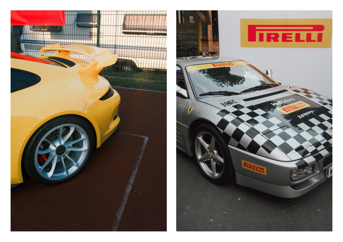 A yellow Porsche 911 GT3 next to a silver Ferrari wrapped in checkered Pirelli race livery