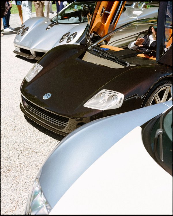 Dark Volkswagen W12 Nardò prototype with raised doors on the Concorso d'Eleganza lawn