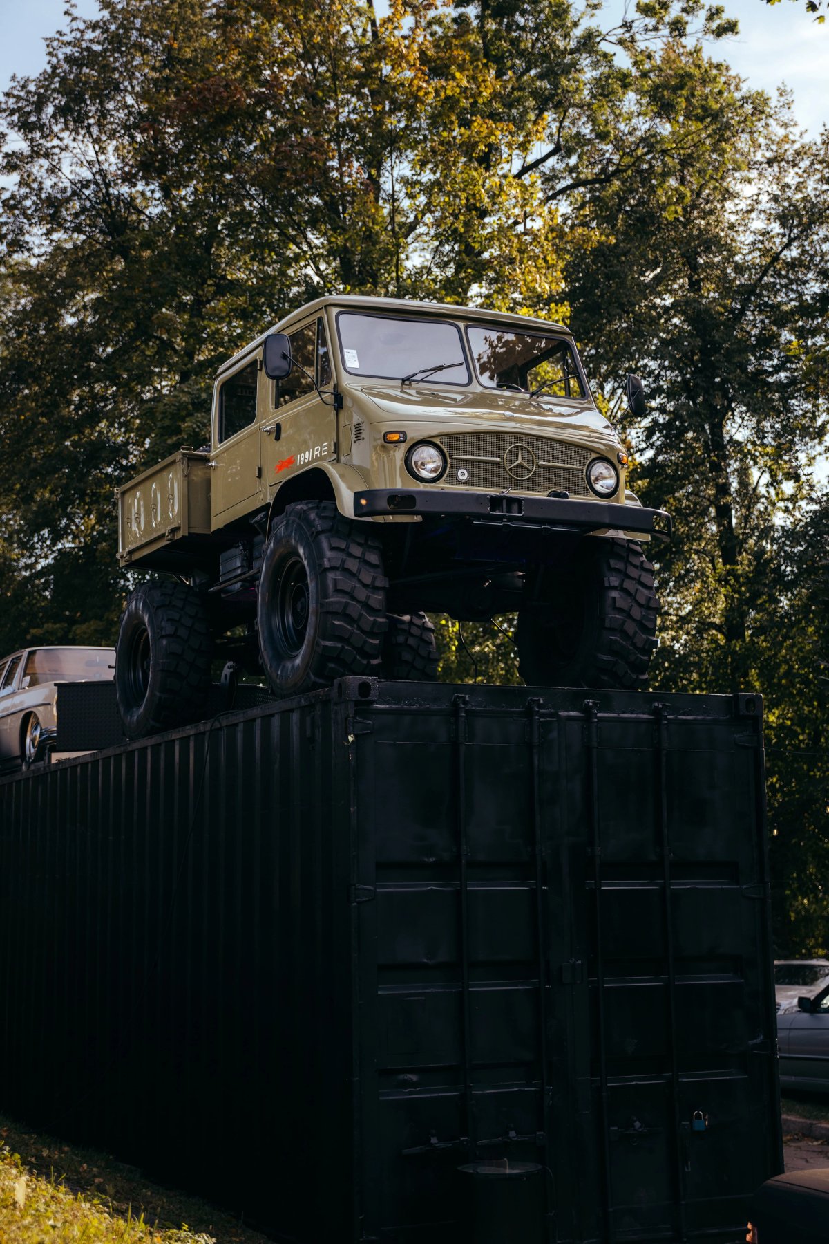 Unimog 404 perched on top of a black shipping container at Substance