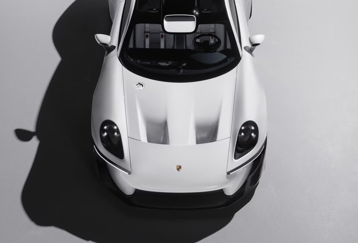 The Porsche Mission S from above on a pale floor, throwing a long hard shadow to the left
