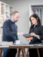 A project manager and designer discussing a project.