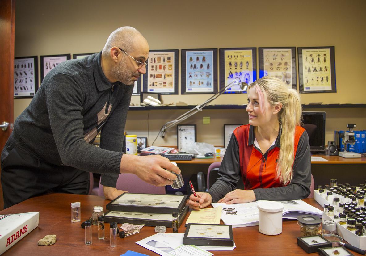 Adams Pest Control technicians receiving expert pest management training from board-certified entomologist Dr. El Damir