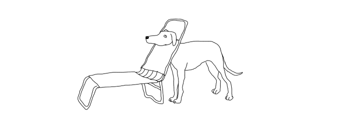 A dog with its head caught in a lounge chair