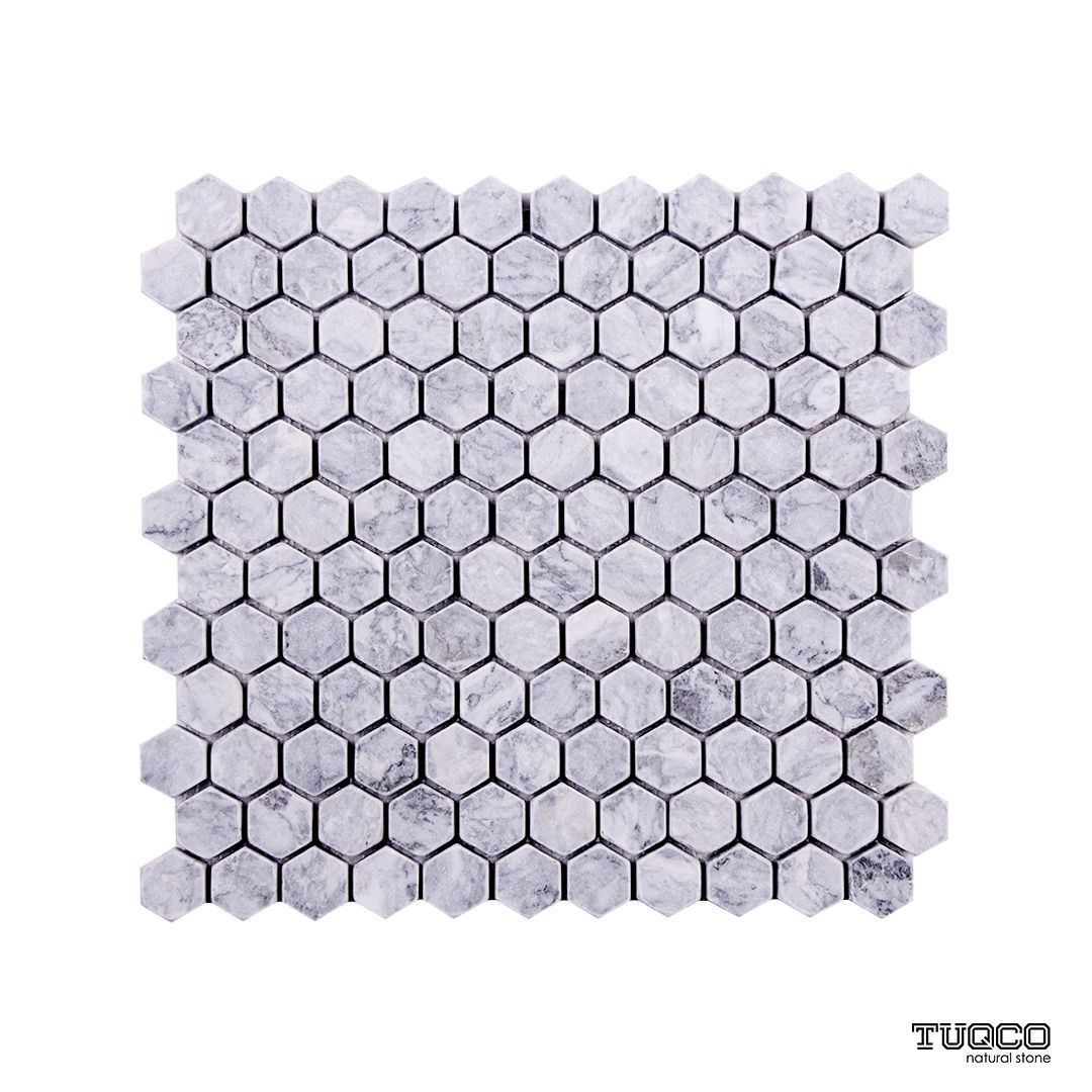 Tumbled Platinum Grey marble one-inch hexagon mosaic tile in silver-grey with dark veining