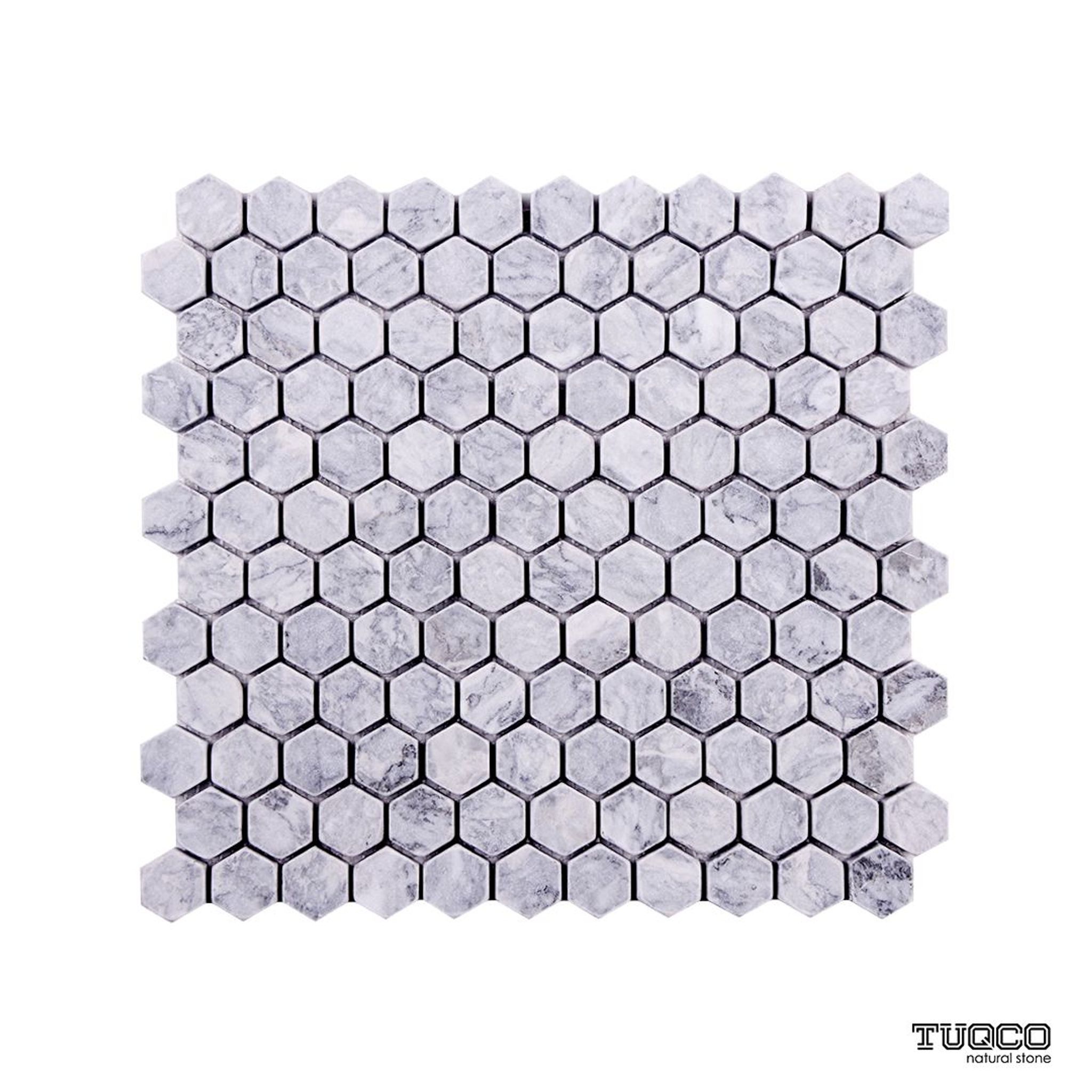 Tumbled Platinum Grey marble one-inch hexagon mosaic tile in silver-grey with dark veining