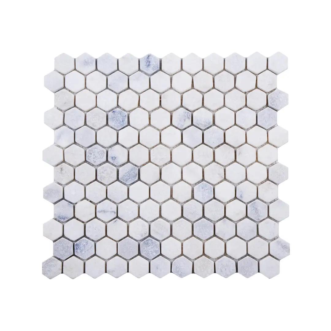Tumbled Carrara White marble one-inch hexagon mosaic tile with cloudy grey veining