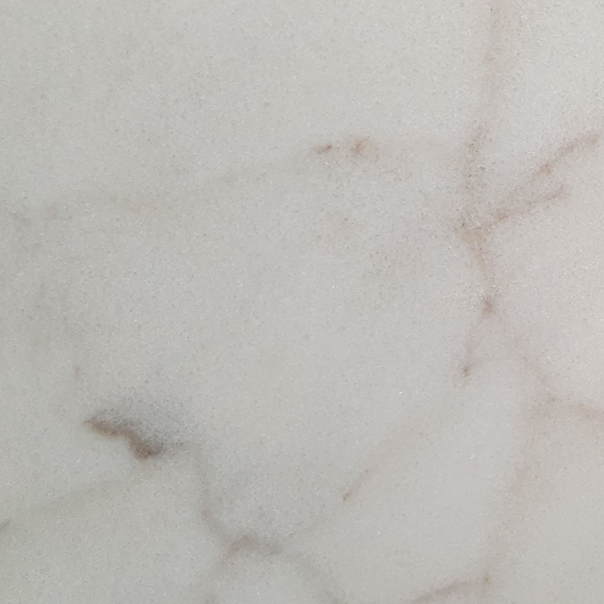 Honed Calacatta Sugar marble tile, creamy white with gold and dove-grey veining