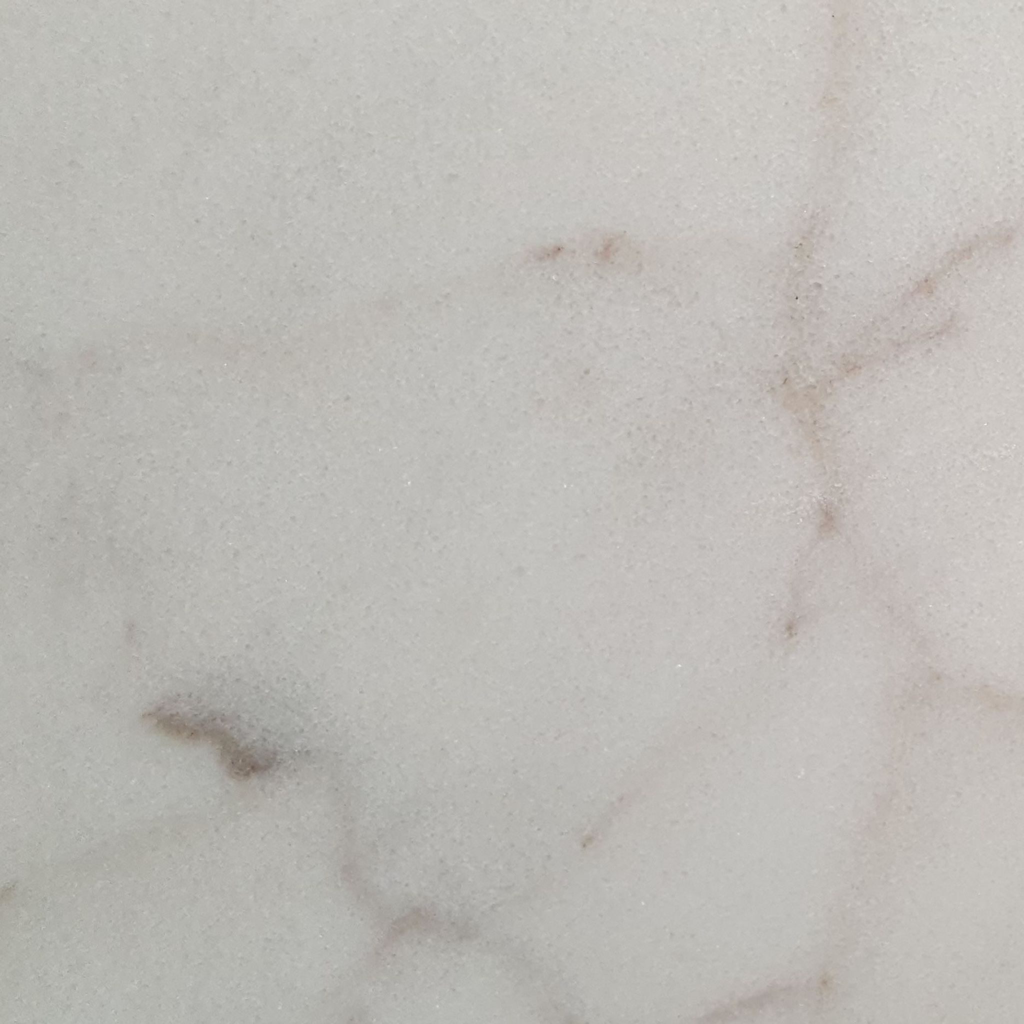 Honed Calacatta Sugar marble tile, creamy white with gold and dove-grey veining