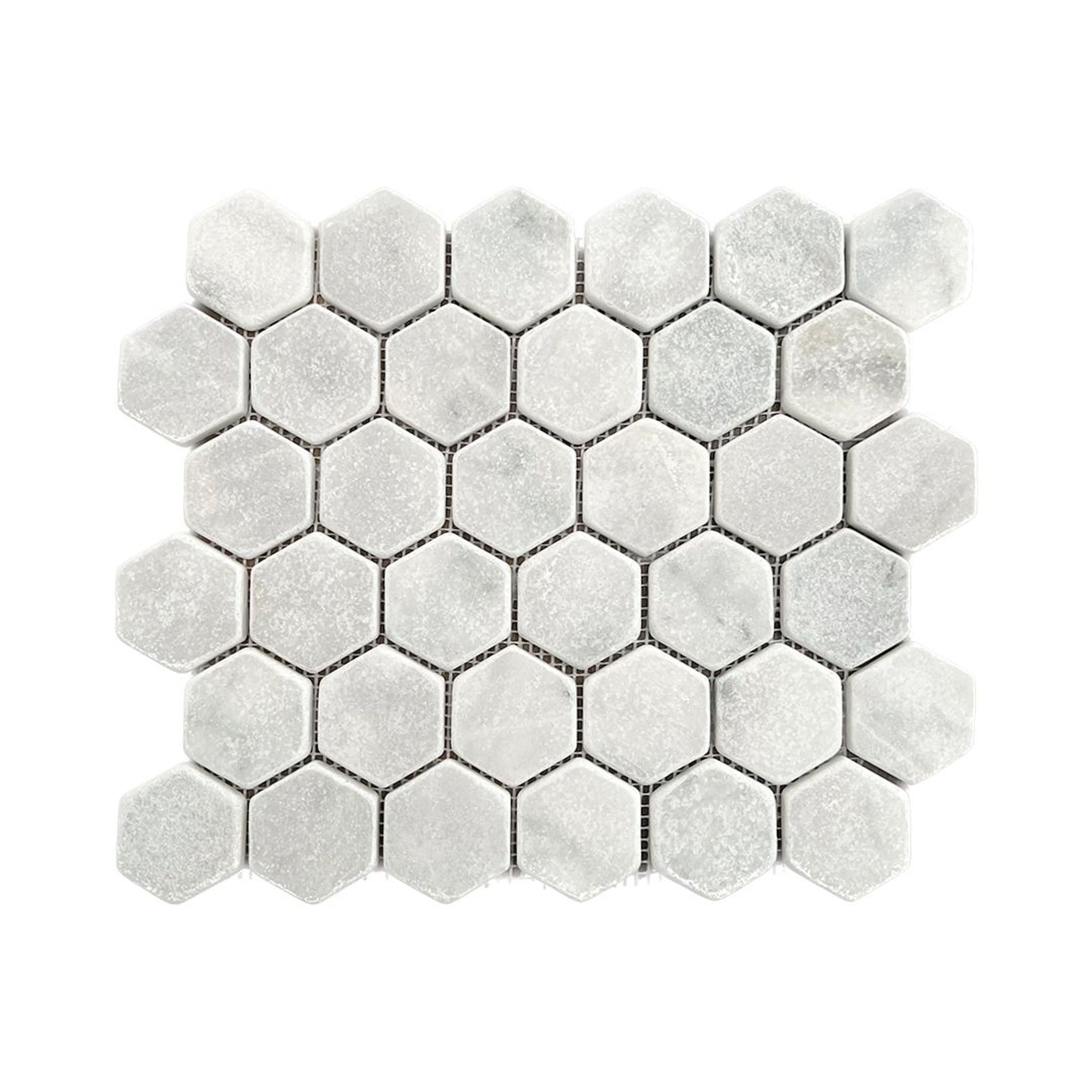 Tumbled Carrara White marble two-inch hexagon mosaic tile with cloudy grey veining