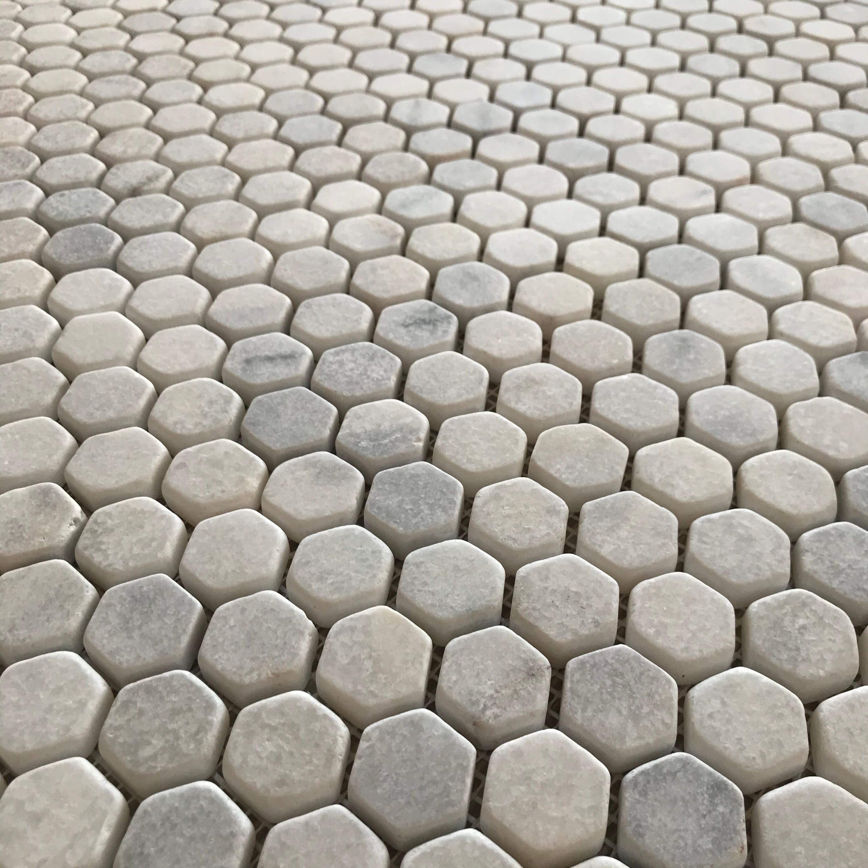 Tumbled Carrara White marble one-inch hexagon mosaic tile with cloudy grey veining thumbnail 3