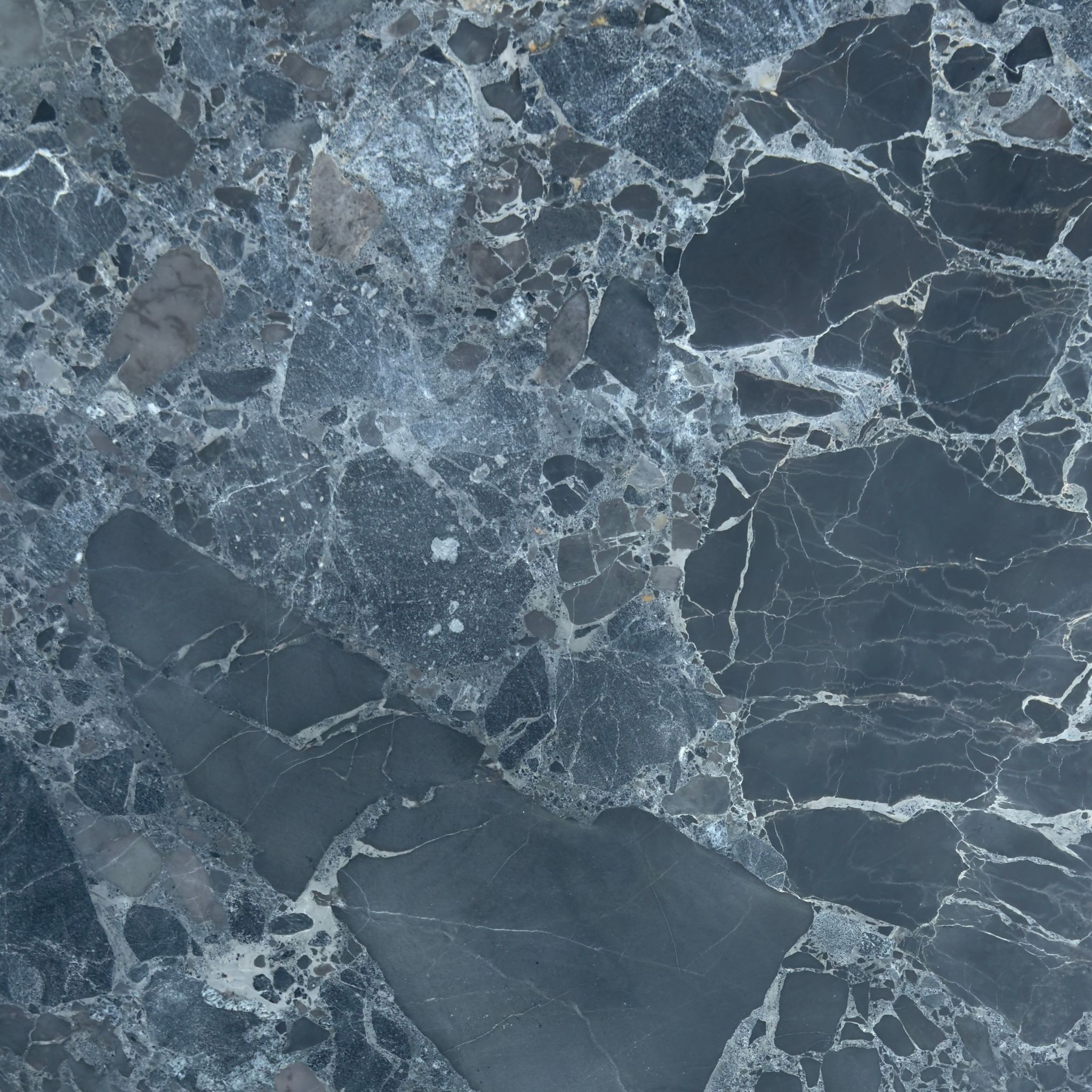 Honed Selene marble tile, charcoal and slate with icy white brecciated veining