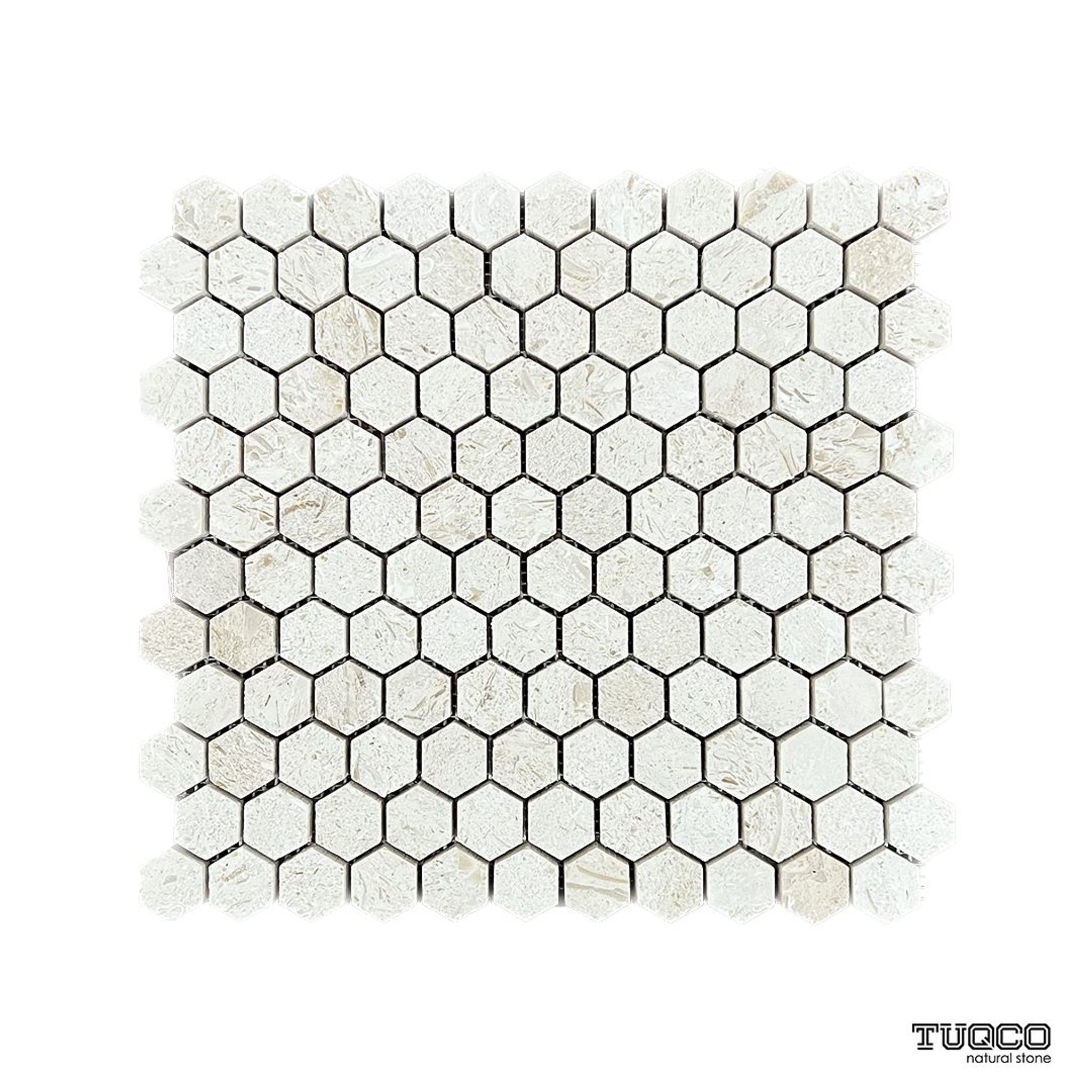 Brushed Shellstone limestone eight-inch hexagon mosaic tile, creamy with fossil inclusions