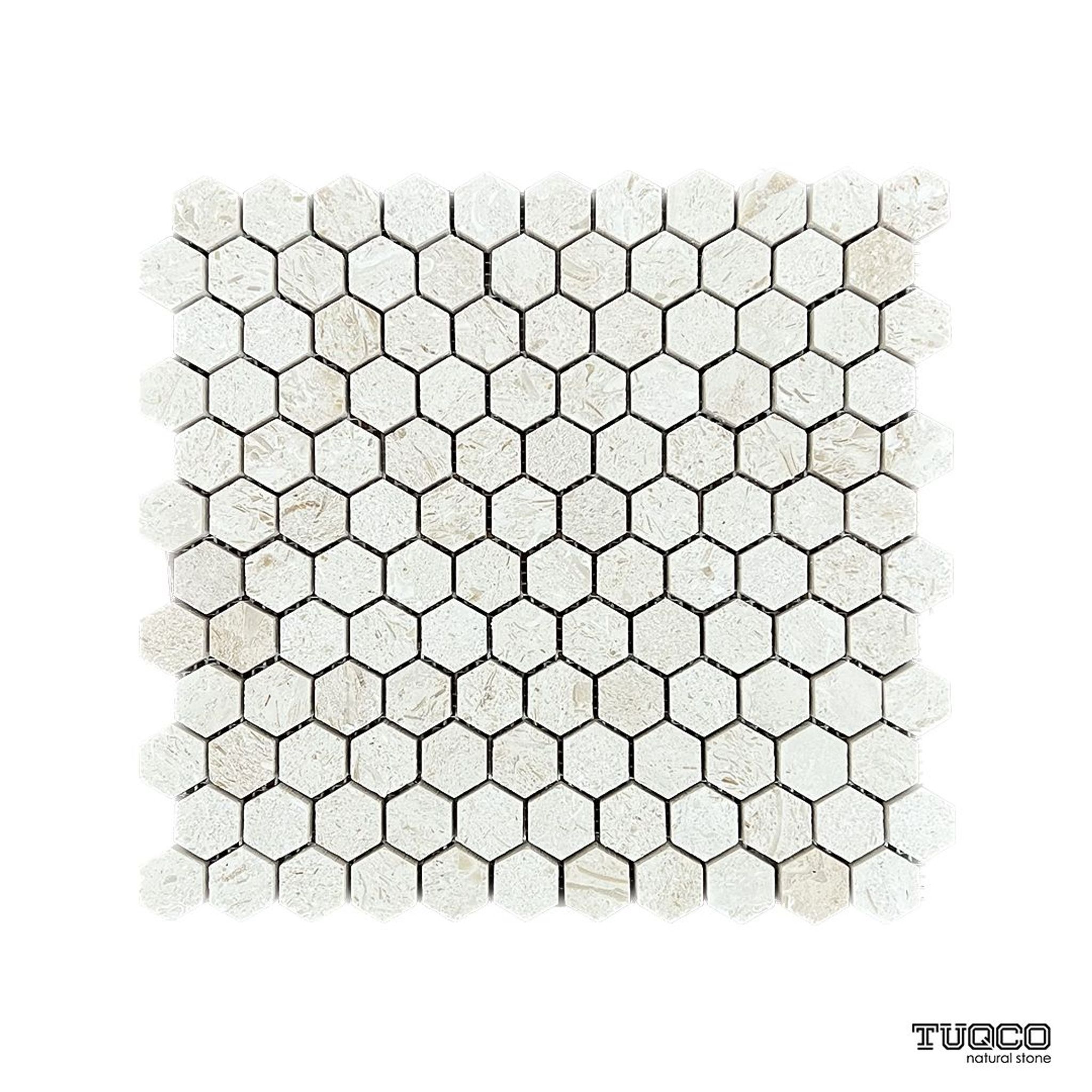 Brushed Shellstone limestone eight-inch hexagon mosaic tile, creamy with fossil inclusions