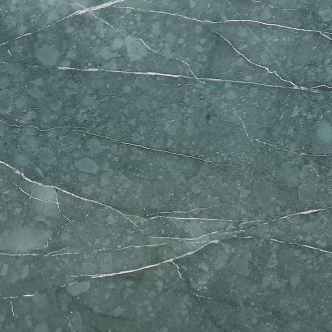 Honed Teos Green marble tile in teal and forest green with white calcite veining