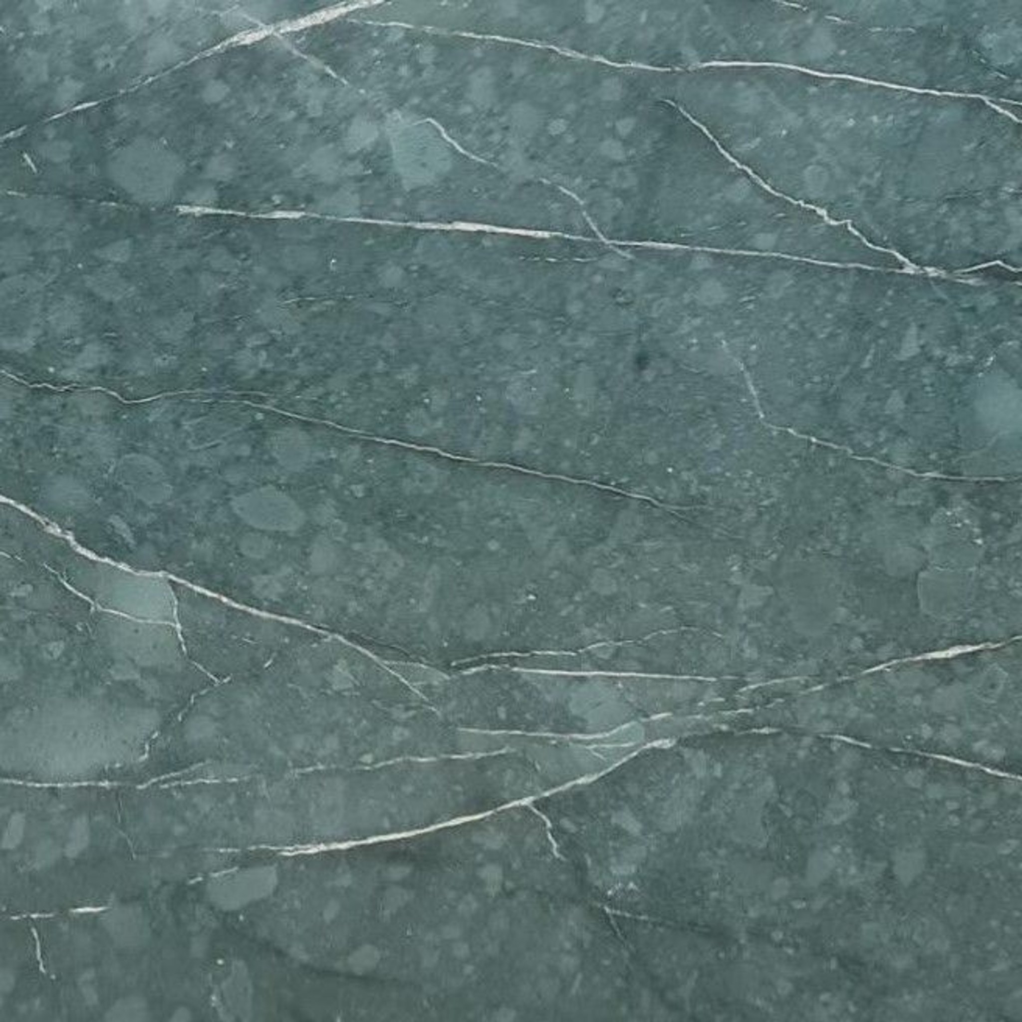 Honed Teos Green marble tile in teal and forest green with white calcite veining