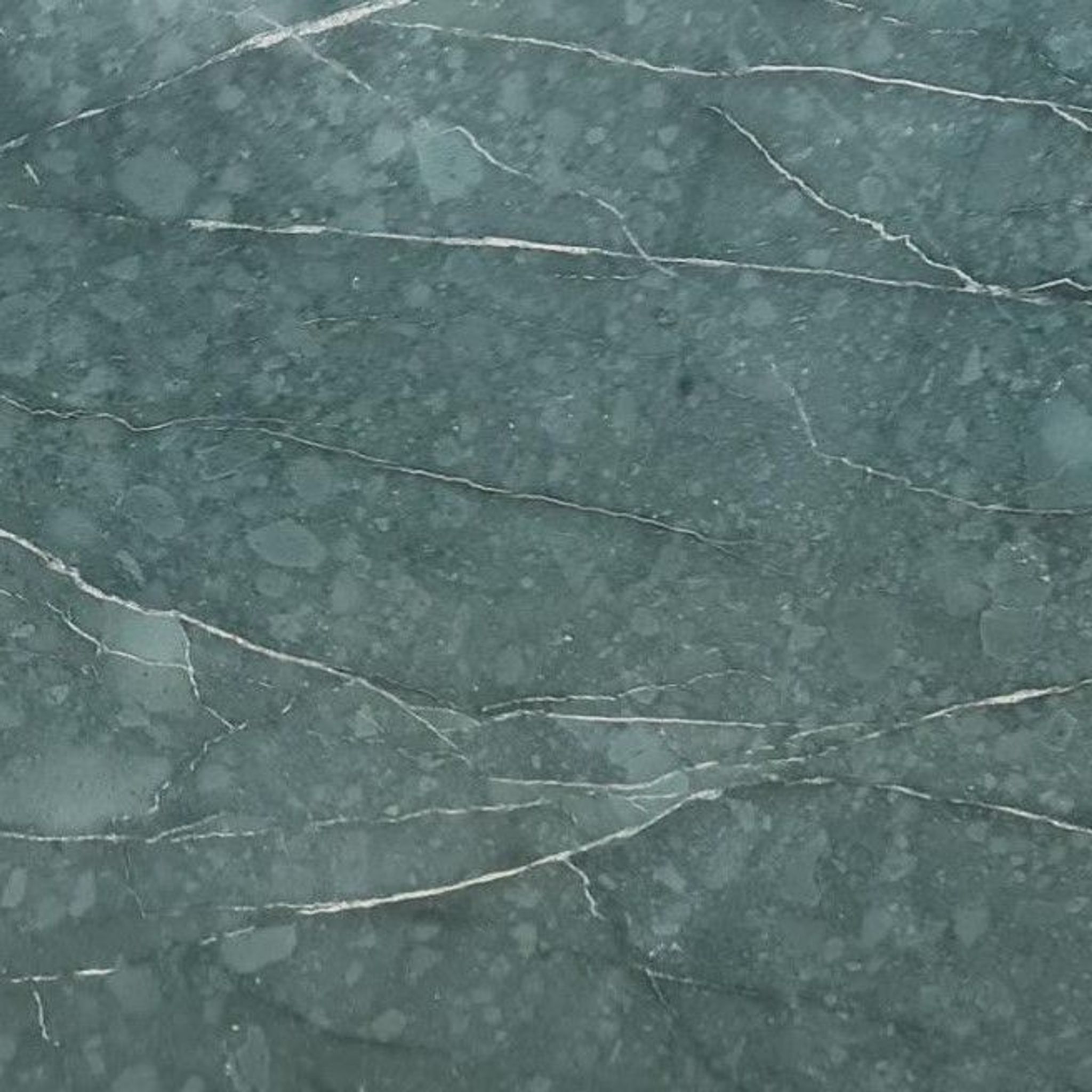 Honed Teos Green marble tile in teal and forest green with white calcite veining
