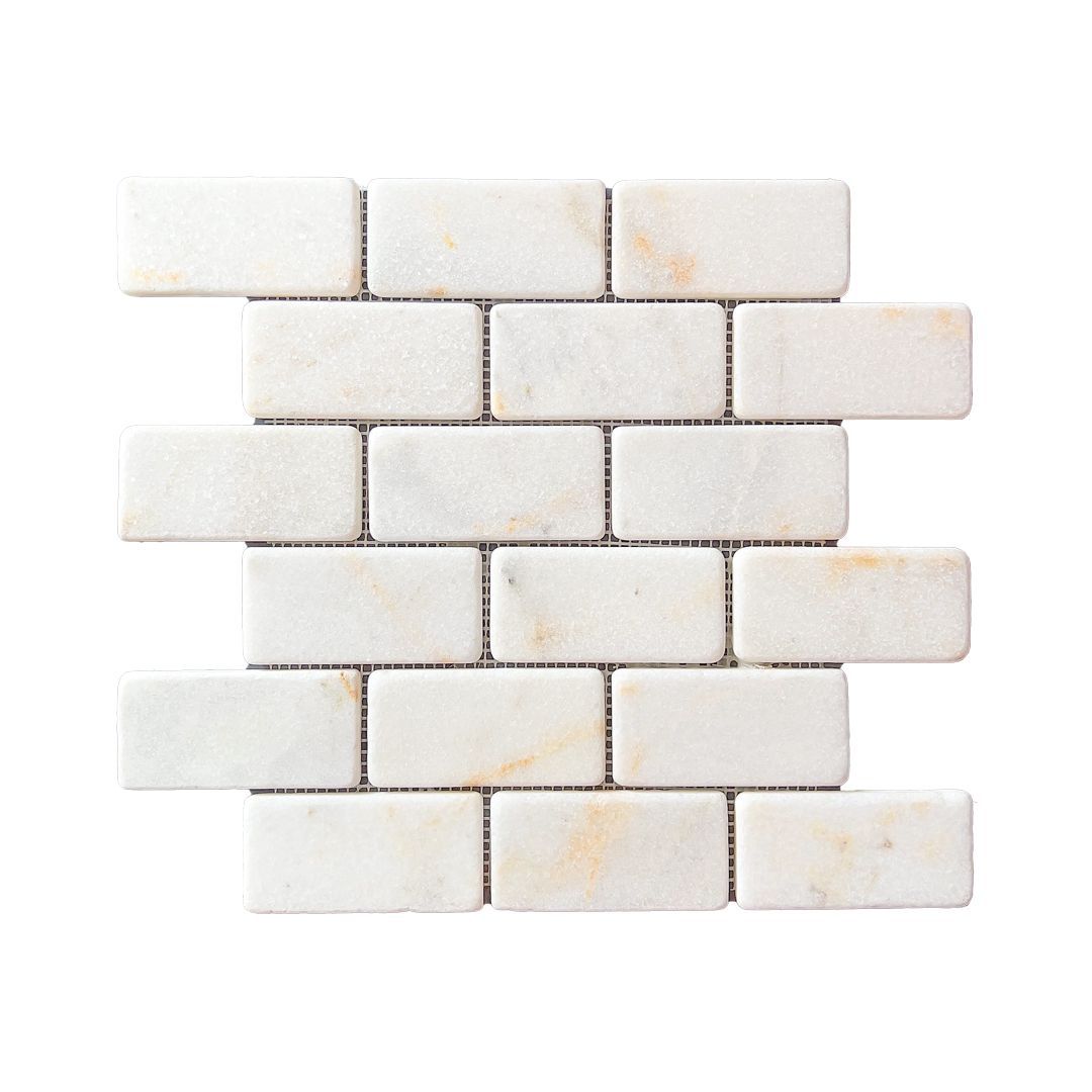 Tumbled Calacatta Sugar marble brick mosaic tile, aged white with gold and ochre