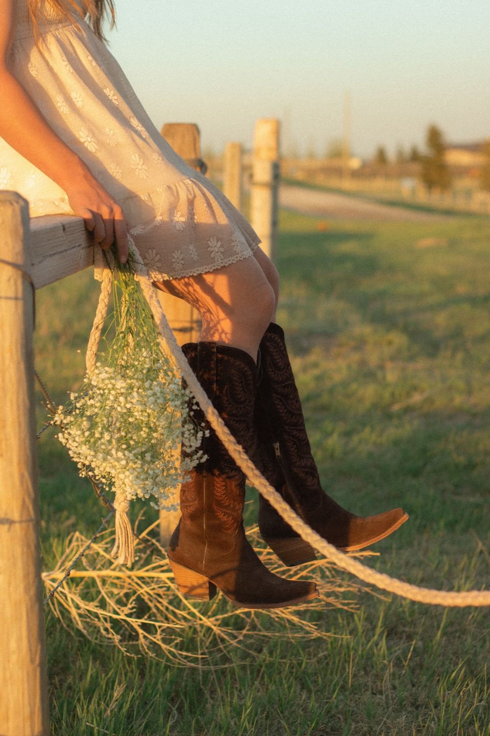 Boots on a fence rail