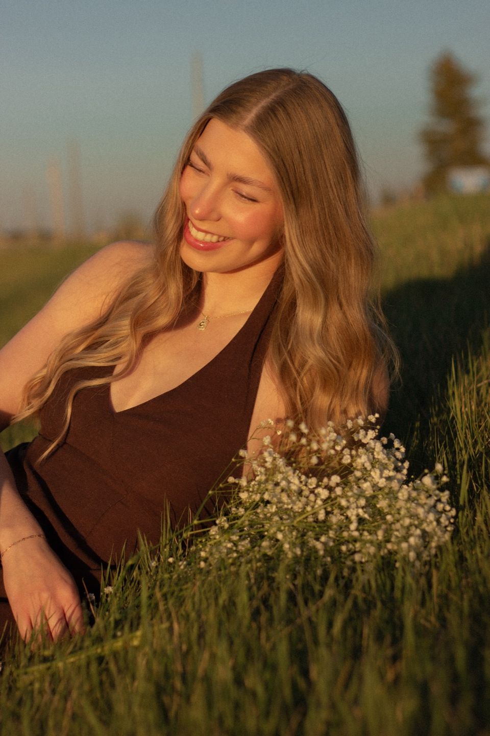 Laughing in the grass with flowers