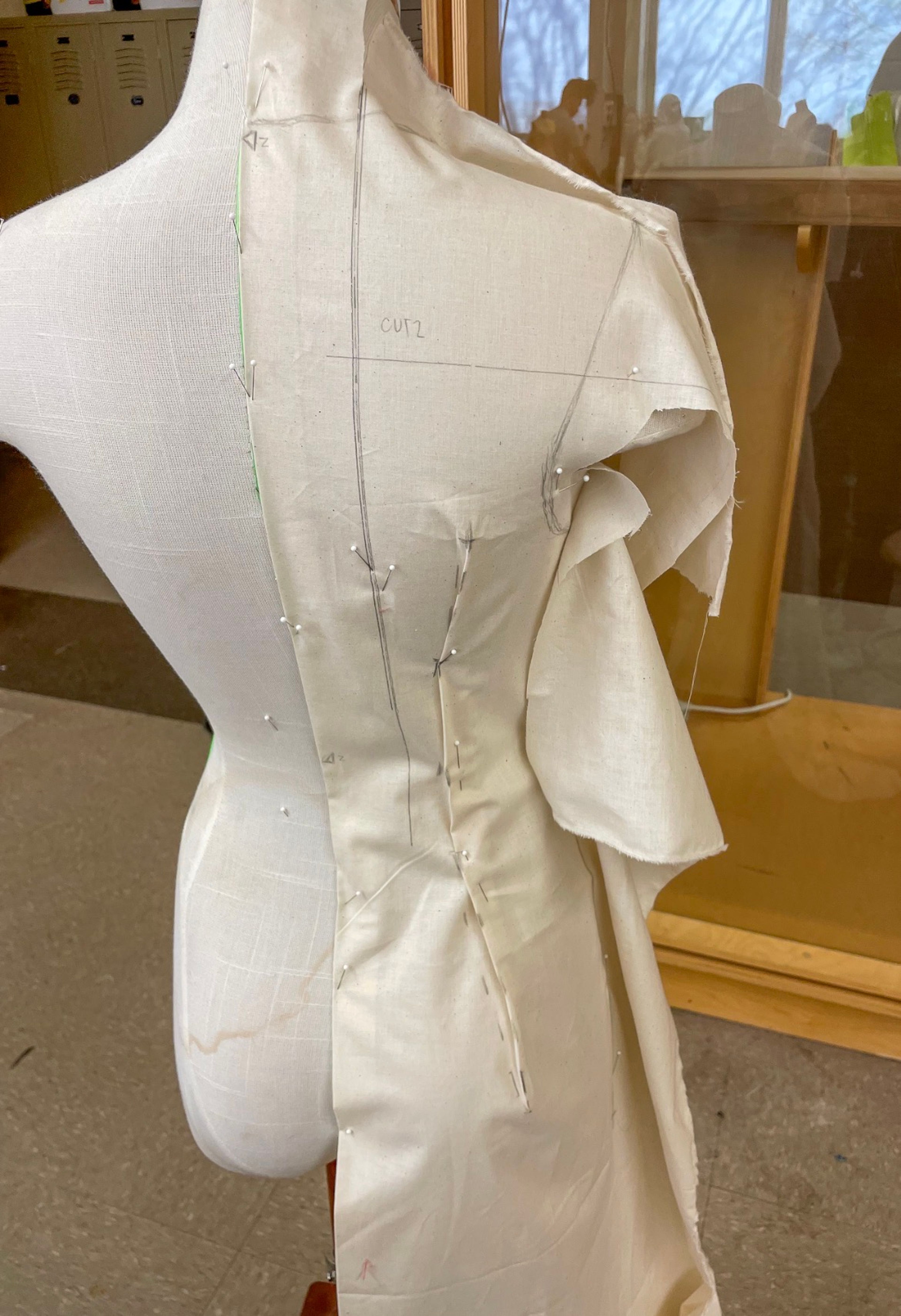 Draping in Progress: Muslin draped and marked on the form